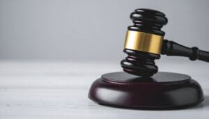 A wooden judge’s gavel resting on a sound block, symbolising legal reform and upcoming changes to leasehold law in the UK.